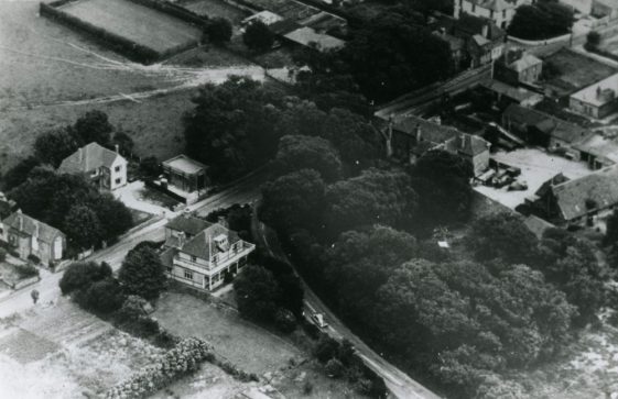 Aerial view of buildings at the junction of Station Road and Dover Road.