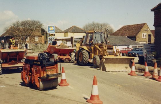 Road works, pile of equipment by Knoll Garage, High Street. 1986 [?]